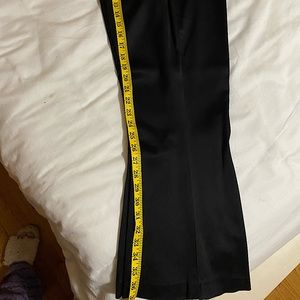 Gorgeous pair of black satin pants with a flare hem to add to your collection.